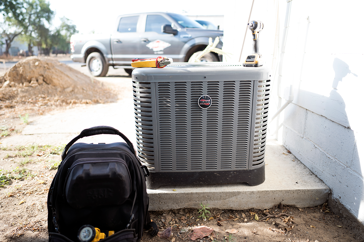 Tech-Bag-Next-to-Heat-Pump-Condenser